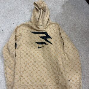 Nike Beige/Gold Hoodie with Black Pattern